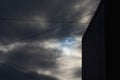 Partial solar eclipse viewed under cloudy skies Royalty Free Stock Photo
