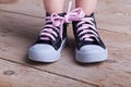 Partial success - child with two shoes tied Royalty Free Stock Photo