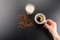 Partial top view of person holding cup of fresh espresso coffee Royalty Free Stock Photo