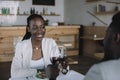 partial view of african american couple clinking glasses of wine Royalty Free Stock Photo