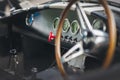 Partial view of a black AC Cobra car interior - classic car show