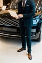 partial view of businessman in formal suit using laptop Royalty Free Stock Photo