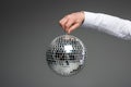 Partial view of businessman hand holding glass disco ball Royalty Free Stock Photo