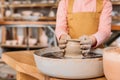 partial view of child making ceramic pot on pottery wheel Royalty Free Stock Photo