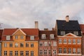 Partial view of the colorful facades of the typical houses in front of the Nyhavn canal in Copenhagen