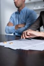 View of couple at table with divorce documents