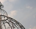 PARTIAL VIEW OF DECORATIVE METAL DOME AGAINST THE SKY Royalty Free Stock Photo