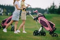 partial view of female golf players in polos walking Royalty Free Stock Photo