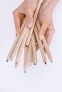 Partial view of female hands holding colorful crayons