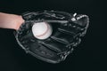 Partial view of hand in glove holding baseball ball Royalty Free Stock Photo