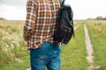 partial view of man in jeans with black leather backpack standing Royalty Free Stock Photo