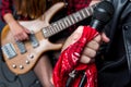 Partial view of man singing in microphone with woman playing guitar Royalty Free Stock Photo