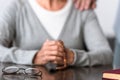 View of man supporting senior mother with grey hair Royalty Free Stock Photo