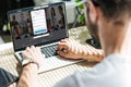 partial view of man using laptop with linkedin website