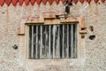 Partial view of an old house facade with a wooden flap