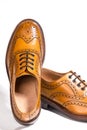 Partial View of Pair of Luxury Male Full Brogued Tan Oxford Shoe