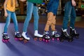 partial view of parents and kids skating on roller