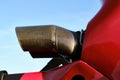 A Partial view of a red helicopter turbine