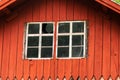 Partial view of a red wooden gable facade with a window on an old house in Sweden Royalty Free Stock Photo