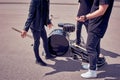 partial view of rock band in black clothing standing near musical instruments