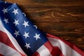 partial view of united states of america flag on wooden surface