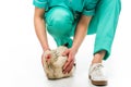 partial view of veterinarian in uniform with chicken