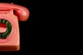 Partial View of Vintage Pink Telephone on a Black Background Royalty Free Stock Photo