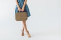partial view of woman holding retro suitcase Royalty Free Stock Photo