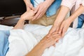 Young people holding elderly hands Royalty Free Stock Photo