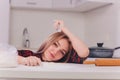 Partial view of young woman in lingerie preparing dough in kitchen. Royalty Free Stock Photo