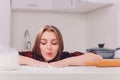 Partial view of young woman in lingerie preparing dough in kitchen. Royalty Free Stock Photo