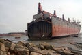 partially broken down ocean ships at a shipbreaking yard. Inside of ship breaking yard