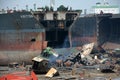 partially broken down ocean ships at a shipbreaking yard. Inside of ship breaking yard