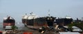 partially broken down ocean ships at a shipbreaking yard. Inside of ship breaking yard