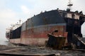 partially broken down ocean ships at a shipbreaking yard. Inside of ship breaking yard