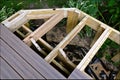 A partially constructed exterior deck with joists and posts in place Royalty Free Stock Photo