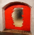 A partially destroyed passage to a mysterious tunnel, a passage to a tunnel laid with red bricks, a dungeon