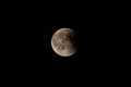 Partially eclipsed full moon, long shot, black sky Royalty Free Stock Photo