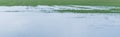 Partially flooded and frozen agricultural field