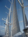 Partially furled sails on large ship