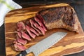 Rare slices of tri-tip steak on a bamboo cutting board Royalty Free Stock Photo