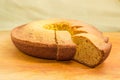 Partially sliced homemade bundt cake close-up at selective focus