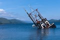 Partially submerged fishing vessel in Loch Linnie