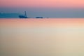 Partially sunken ship after sunset dusk