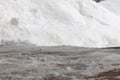 Partially thawed snow and ice covered wooden deck