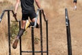 Participant in extreme obstacle race Royalty Free Stock Photo