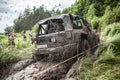 Participant on Jeep passes a deep muddy pit.