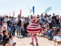 A participant of the Purim festival dressed in fabulous costume, shows a show with soap bubbles in Caesarea, Israel