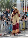 Participants of the annual carnival of Adloyada walking on stilts, dressed in fabulous costumes in Nahariyya, Israel Royalty Free Stock Photo