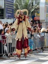 Participants of the annual carnival of Adloyada walking on stilts, dressed in fabulous costumes in Nahariyya, Israel Royalty Free Stock Photo